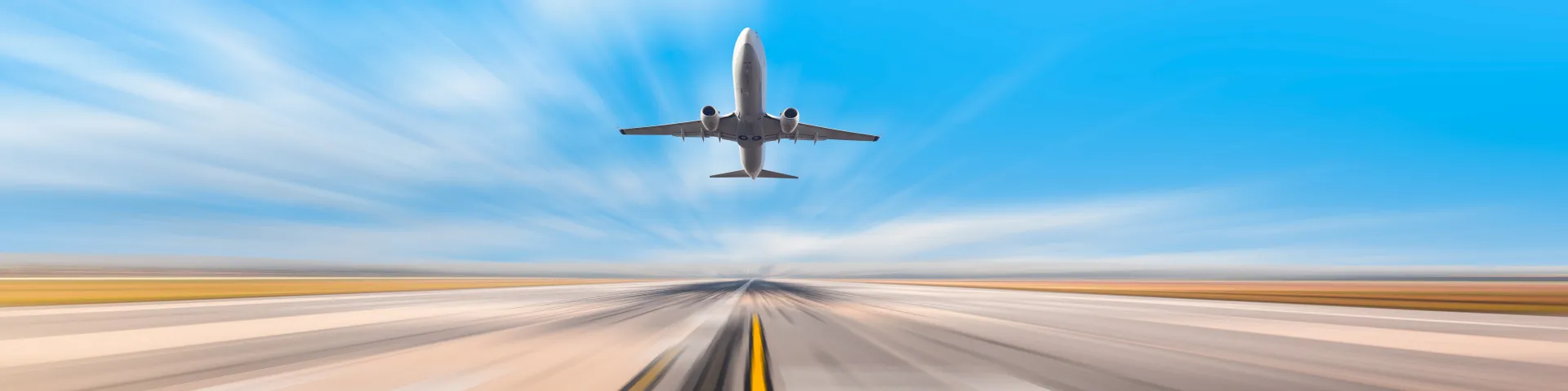 旅客機が滑走路から離陸した直後の疾走感あふれる画像